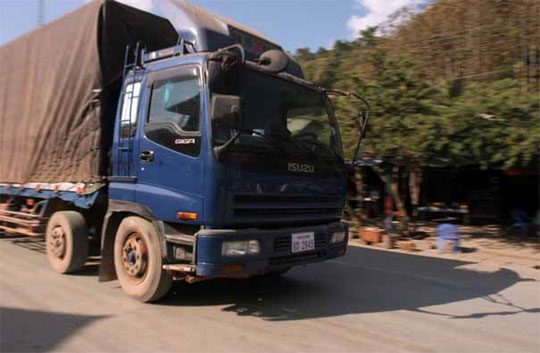 A truck heading south in Laos loaded with Chinese goods - Andy Scott/ASIA BRIEFING