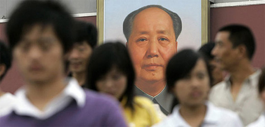 Chairman Mao looks over visitors to the Forbidden City / Associated Press